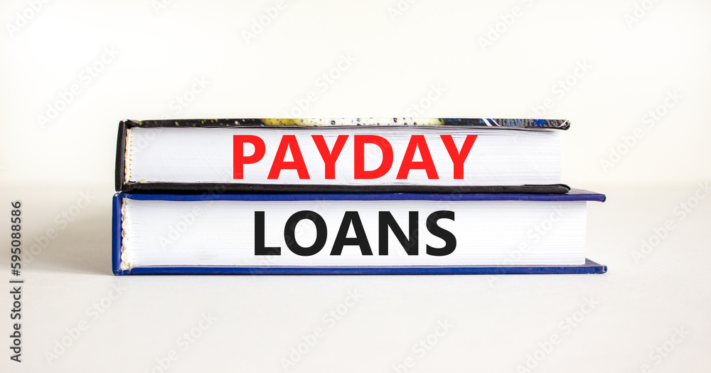 Payday loans symbol. Concept words Payday loans on beautiful books. Beautiful white table white background. Business and Payday loans concept. Copy space.