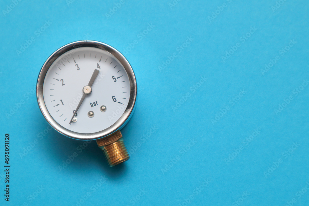 Pressure gauge, measuring instrument close up on pneumatic or hydraulic control system. Hydraulic equipment is used for measuring pressure in the system Pressure gauge, measuring instrument close up on pneumatic or hydraulic control system. Hydraulic equipment is used for measuring pressure in the system