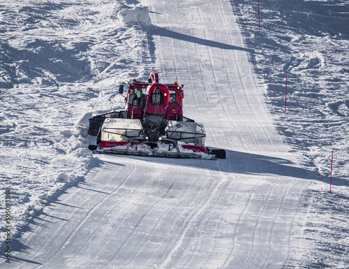 Snowcat, ratrack - machine for snow preparation while working in Alpe D'huez - One of the most popular ski resorts in the Alps in France photo