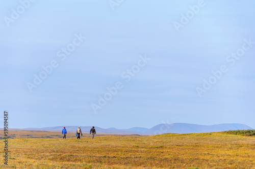 USA, Alaska, Noatak National Preserve, Noatak River. Hikers on the arctic tundra.