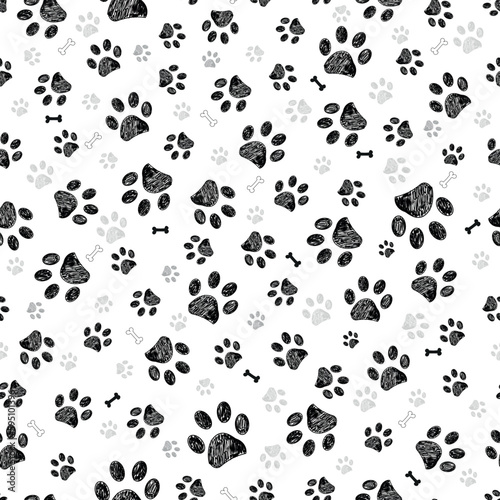 Black gray doodle paw prints and black bones. Seamless fabric design pattern