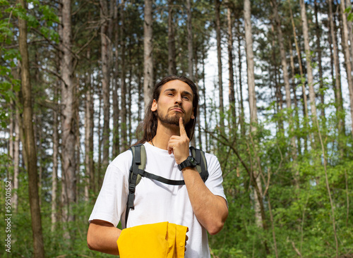 Long hair man in forest photo