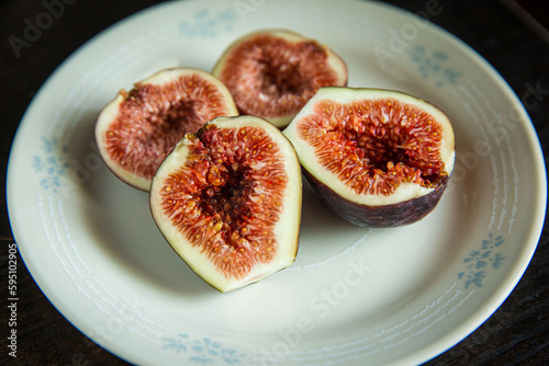 Fresh figs cut in half on small plate