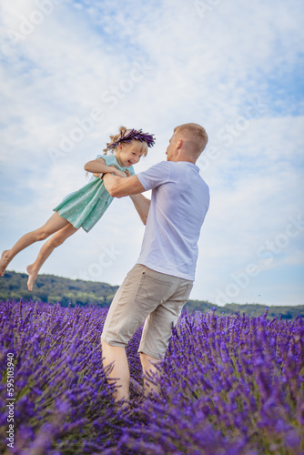 father lifts his daughter