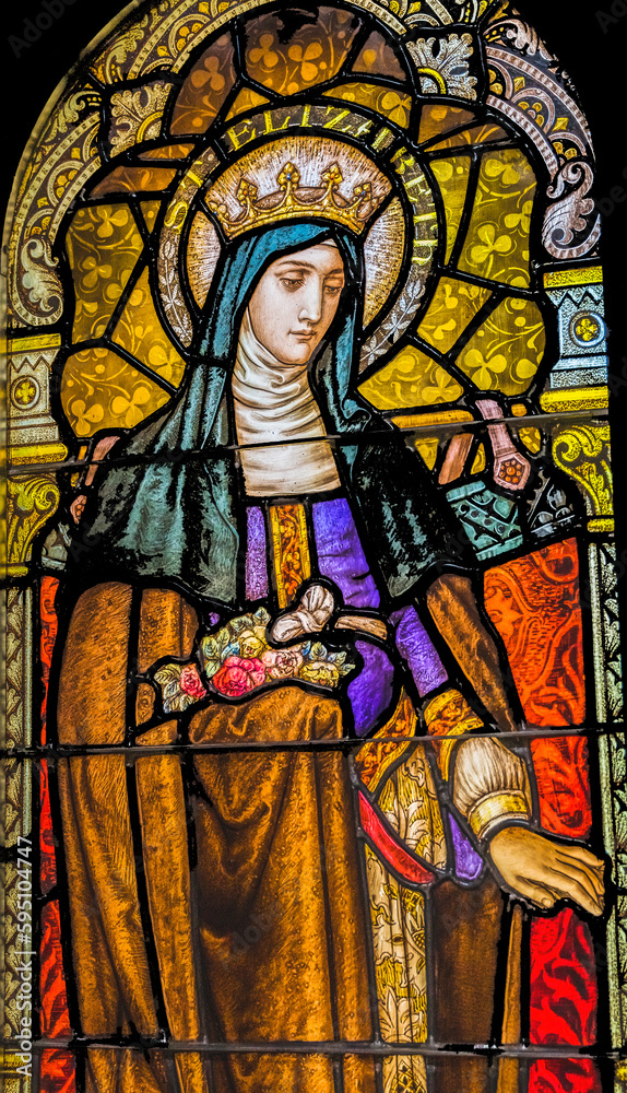 Saint Elizabeth of Hungary stained glass, Phoenix, Arizona. Saint Elizabeth of Hungary former queen became nun. Church rebuilt stained glass 1915