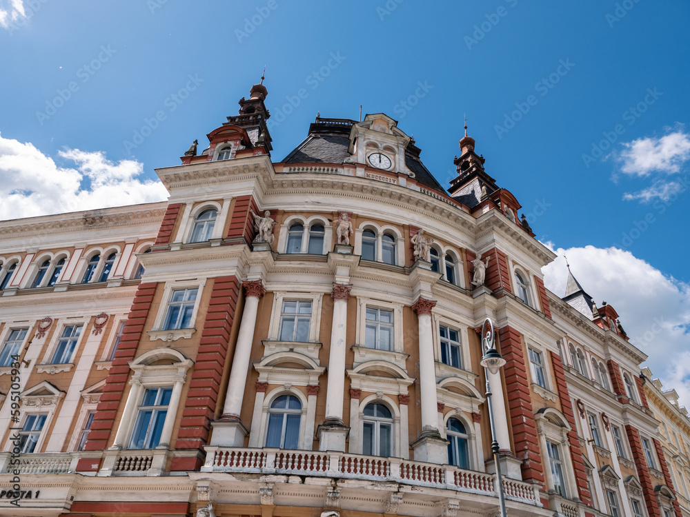 Old Main Post Office Building Exterior in Karlovy Vary, Czech Republic from the Austro Hungarian Empire with Four Allegorical Statues Representing Telegraph, Railway, Ship Transport and Mail