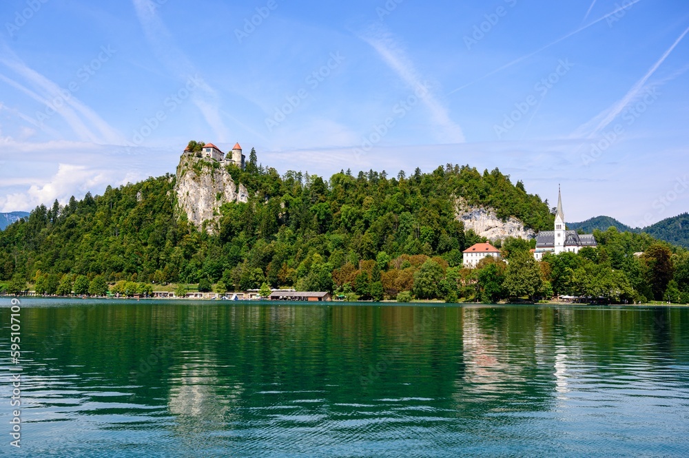 Beautiful idyllic view on island, castle, catholic Maria church in lake Bled.  Slovenia