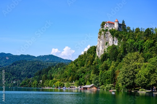 Beautiful idyllic view on island, castle, catholic Maria church in lake Bled.  Slovenia