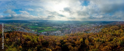 Aerial panorama on town Gelnhausen, Marienkirche chuch, cloudy sky, yellow trees. Hesse, Hessen, Germany
