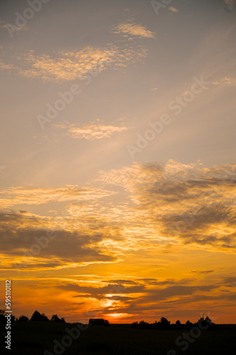 Beautiful sunset over the field, vertical photo