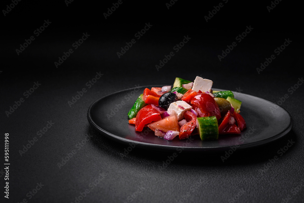 Delicious, fresh Greek salad with feta cheese, olives, tomatoes and cucumbers Delicious, fresh Greek salad with feta cheese, olives, tomatoes and cucumbers