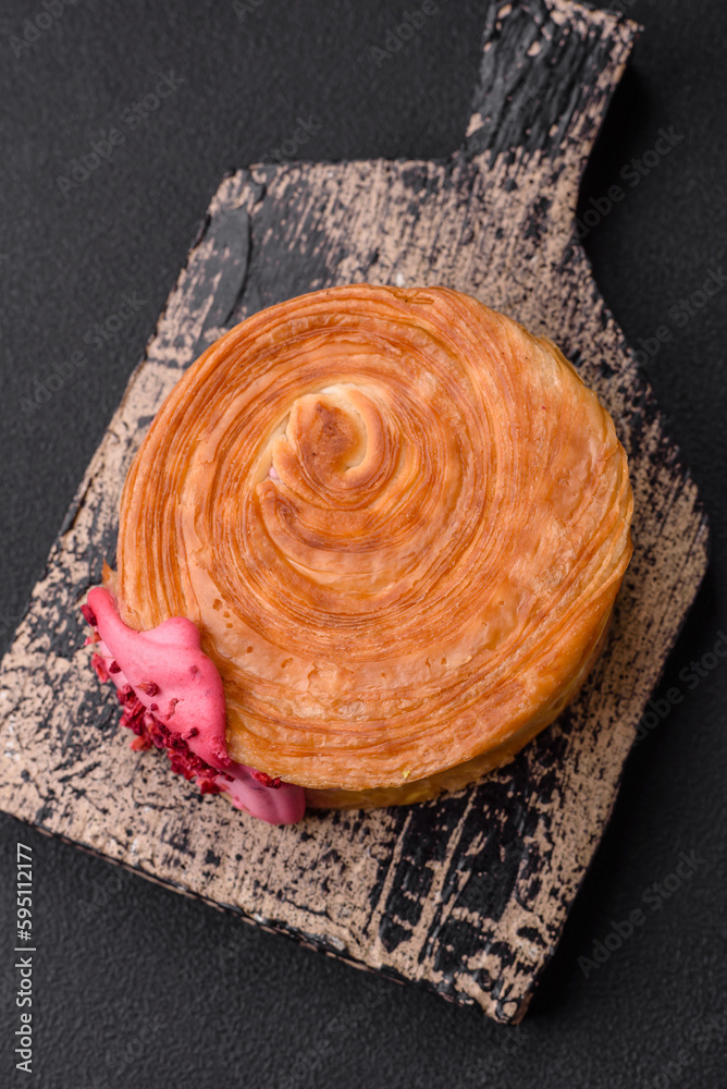 Round puff pastry croissant with raspberry filling or new york roll Round puff pastry croissant with raspberry filling or new york roll