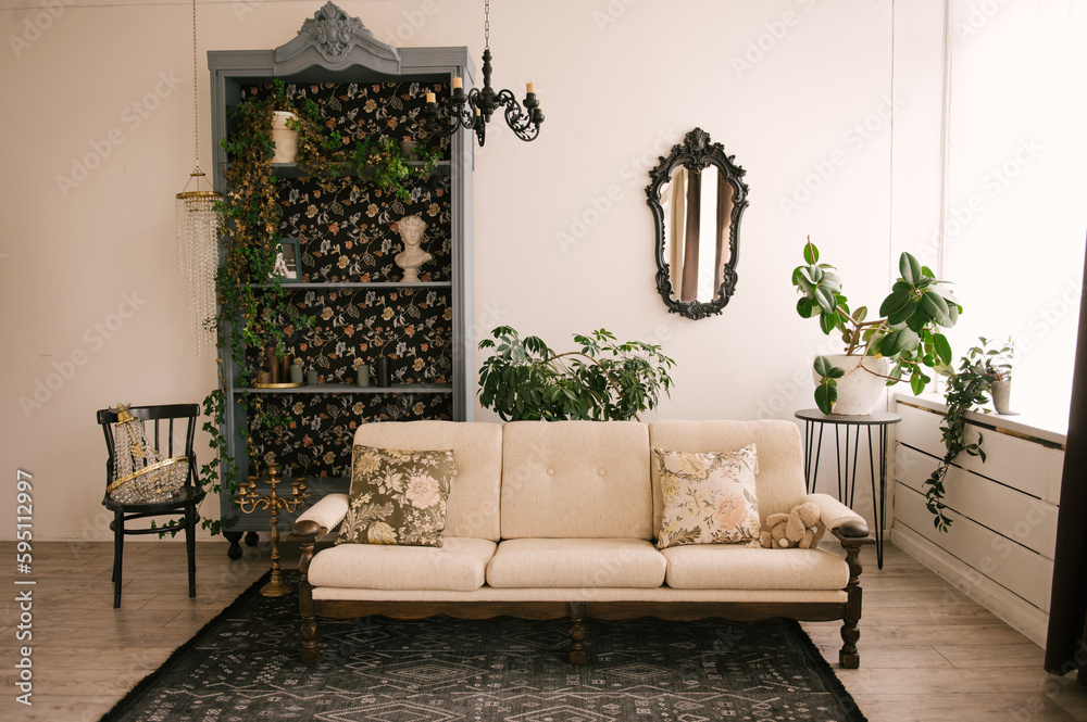 Classic interior, with wooden sofa, vintage sideboard, mirror and flowers