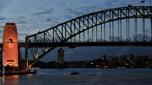Sydney Harbour Bridge-arch and pylon-viewed from the Opera House at twilight under floodlight. NSW-Australia-586