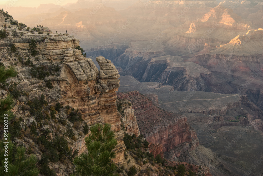 cliff in Grand Canyon background hazy in distance