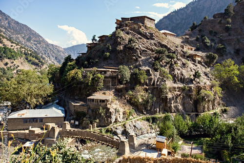 Traditional Kalash wooden house in Kalash valley in Pakistan photo