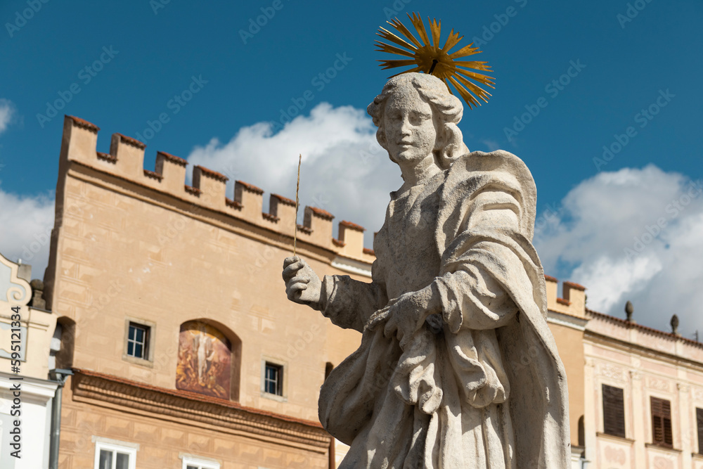 Telc, Czechia - 03 30 2023, Staue detail with historical buildings of Telc town on background