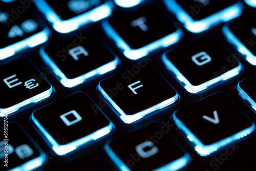 Close-up of laptop keyboard illumination, backlit keyboard