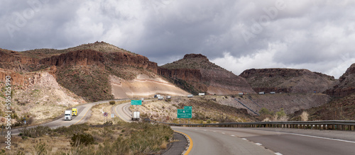 Landscape on I40 Eastbound just outside Kingman, Arizona shows the exposed volcanic ash deposits from the road cut photo