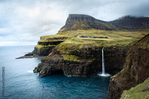 Waterfall and cliffs in Gasadalur, Faroe Islands, Vagar island, Denmark