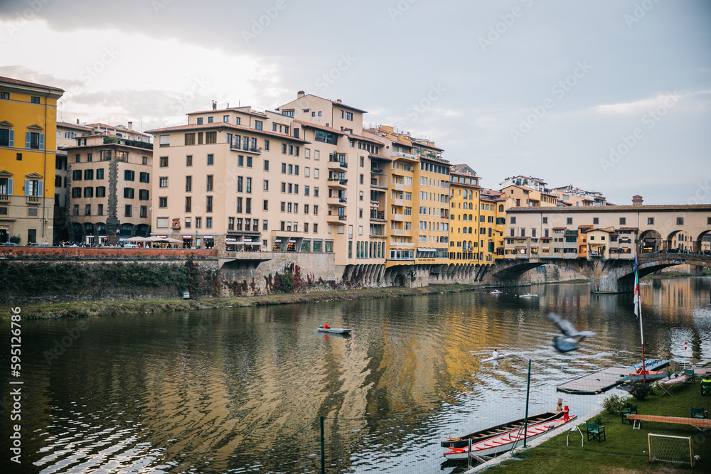 Looking out at the Arno River and Ponte Vecchio in Florence, Italy at Sunset