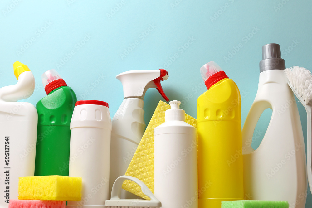 A set of different cleaning and disinfectant products on a coloured background A set of different cleaning and disinfectant products on a coloured background