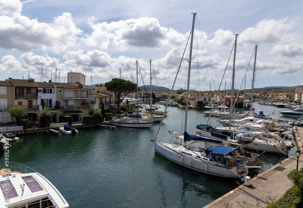 View over Port Grimaud marina in France in spring with yachts and sailing boats
