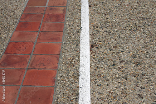 Wallpaper Mural Concrete sidewalk with red tiles and a painted white border line Torontodigital.ca