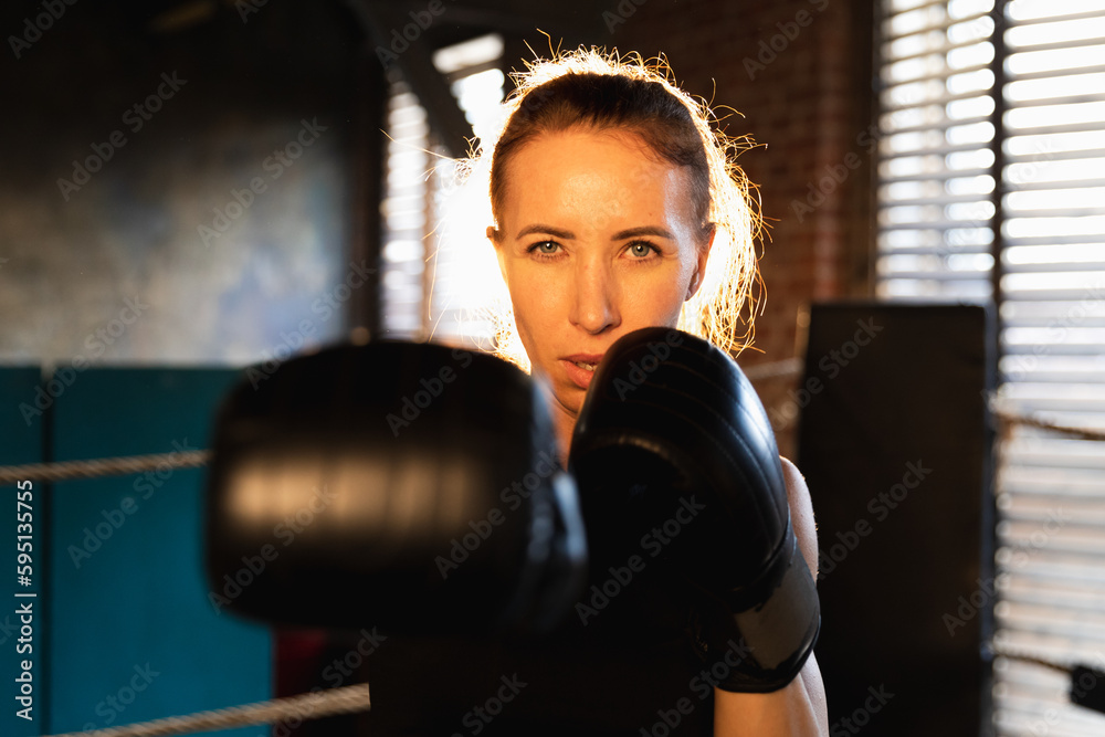 Women self defense girl power. Strong woman fighter punching with