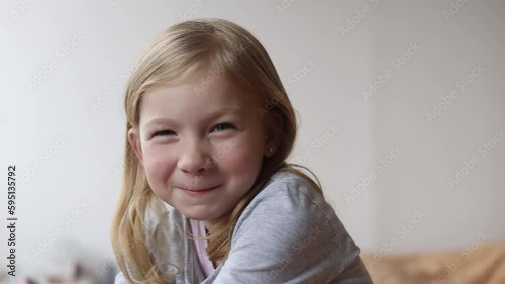 Child girl smiling making faces, fooling around Child girl smiling making faces, fooling around