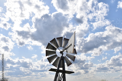 Windmill Under a Cloudy Blue Sky