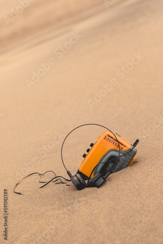 Φωτογραφία Vintage technology: old yellow walkman personal stereo cassette player resting o
