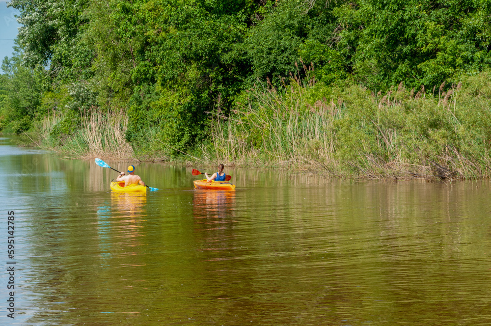 Kayaks On The River In Summer Kayaks On The River In Summer
