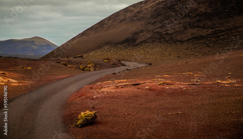 Amazing panoramic landscape of volcano in Timanfaya national park. Popular touristic in Lanzarote island Canary islans Spain. Artistic picture. Travel concept photo