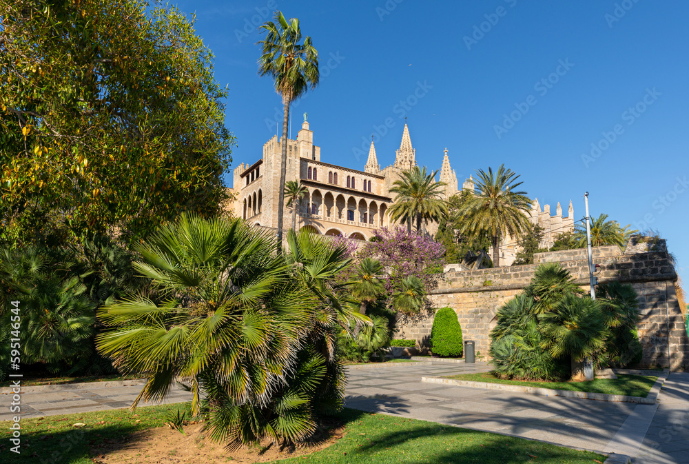 Almudaina Palace and Cathedral of Palma de Mallorca (Balearic Islands, Spain) seen from the gardens of s'Hort des Rei, in the centre of the city.