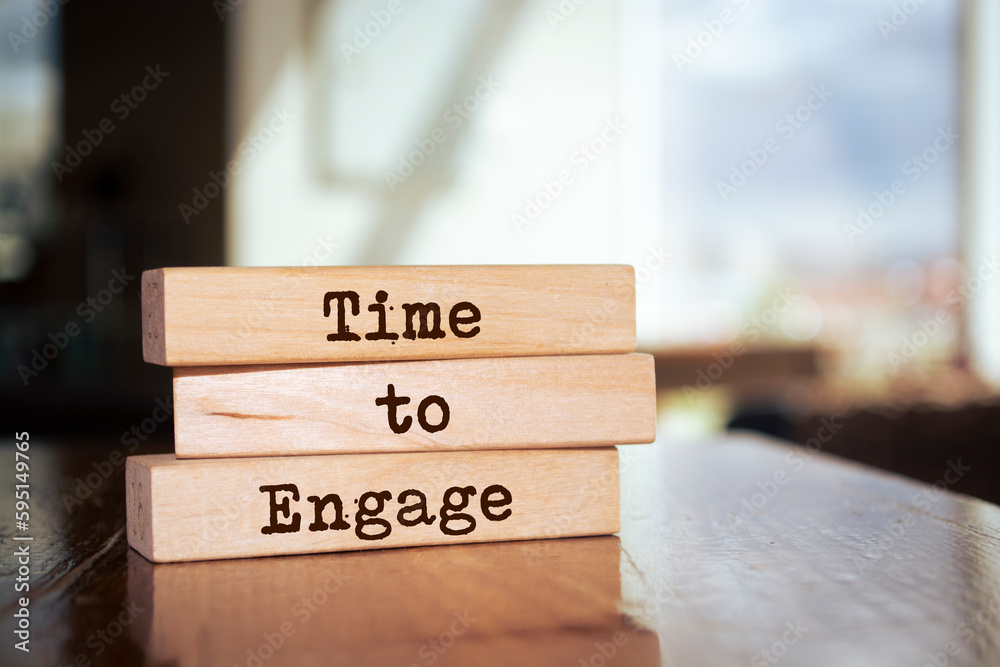 Wooden blocks with words 'Time to Engage'. Wooden blocks with words 'Time to Engage'.