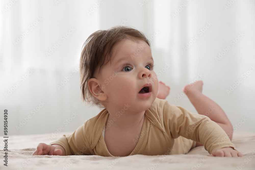 Portrait of cute little baby on bed indoors Portrait of cute little baby on bed indoors