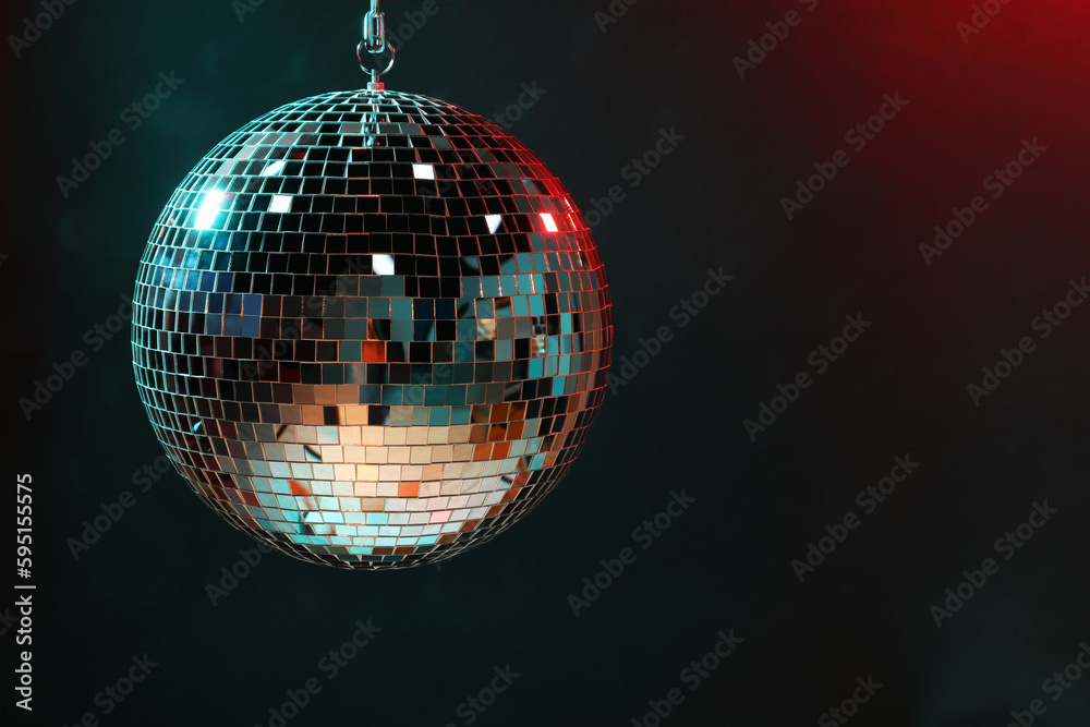 Obraz premium Shiny disco ball on dark background, space for text