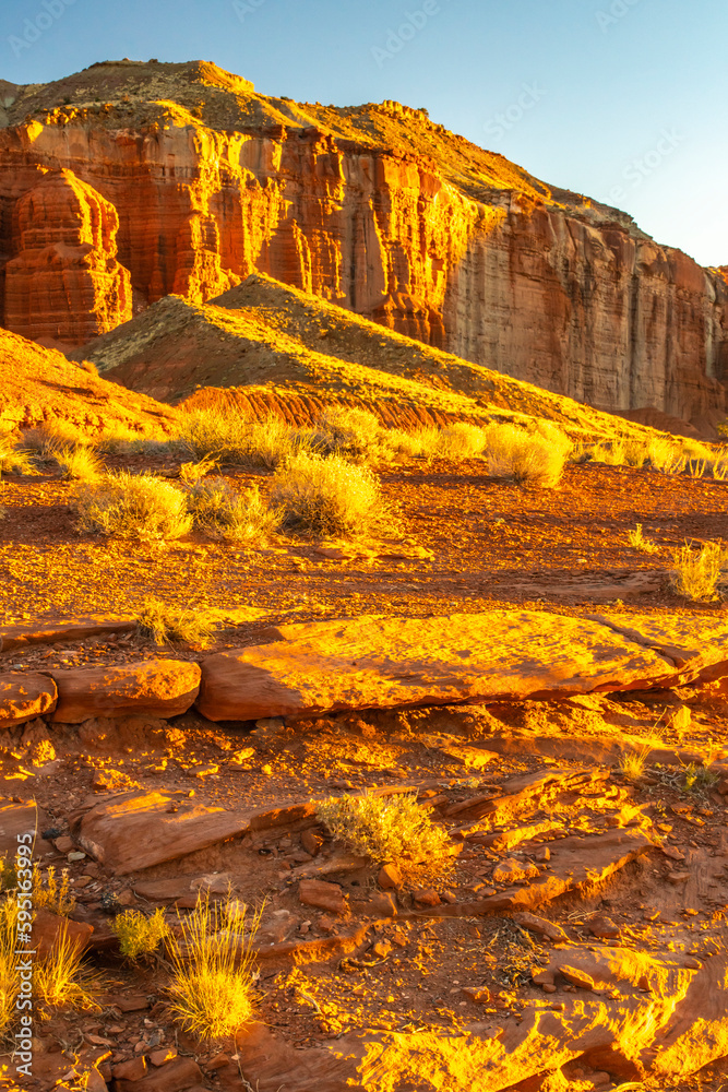 USA, Utah, Capitol Reef National Park. Sunrise on eroded cliff formations.