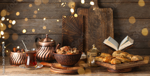 Canvas Print Traditional Eastern dishes with Quran book on table