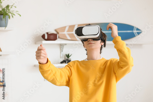 Teenage boy with VR glasses...
