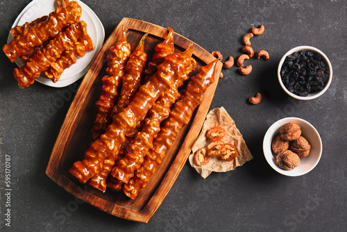 Canvastavla Composition with tasty churchkhela, nuts and raisin on dark background