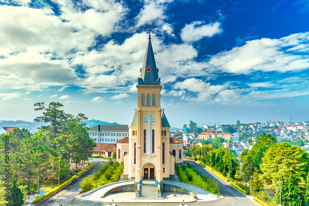 Fototapeta premium Aerial view outside Cathedral chicken in Da Lat, Vietnam on a morning. Old French architecture attracts parishioners to pray for peace at the weekend