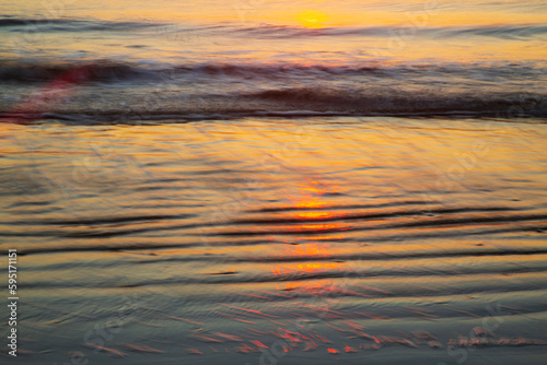 USA  Georgia  Tybee Island. Sunrise with ripples in the sand