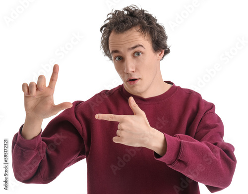 Shocked young man showing l...