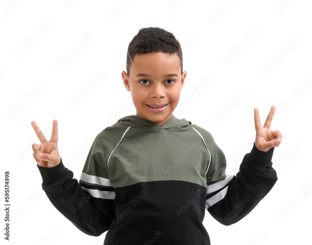 Little African-American boy showing peace gesture on white background Little African-American boy showing peace gesture on white background