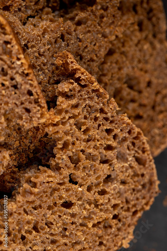 pieces of black rye bread from mixed wheat flour with rye flour