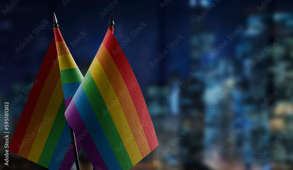 Small flags of the lgbt on an abstract blurry background