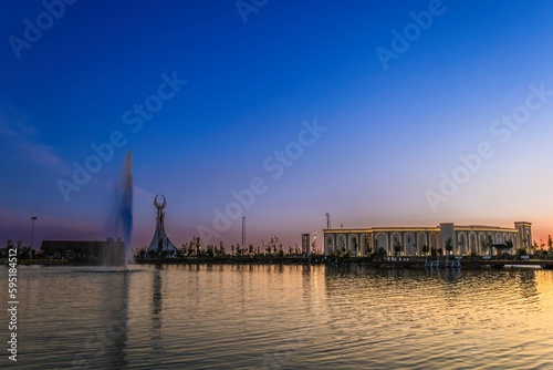 Memorial of Freedom and Independence in the form of a pyramid with a structure of national color on the square of the city park "New Uzbekistan" (Yangi Uzbekistan) with a tower where the Humo bird