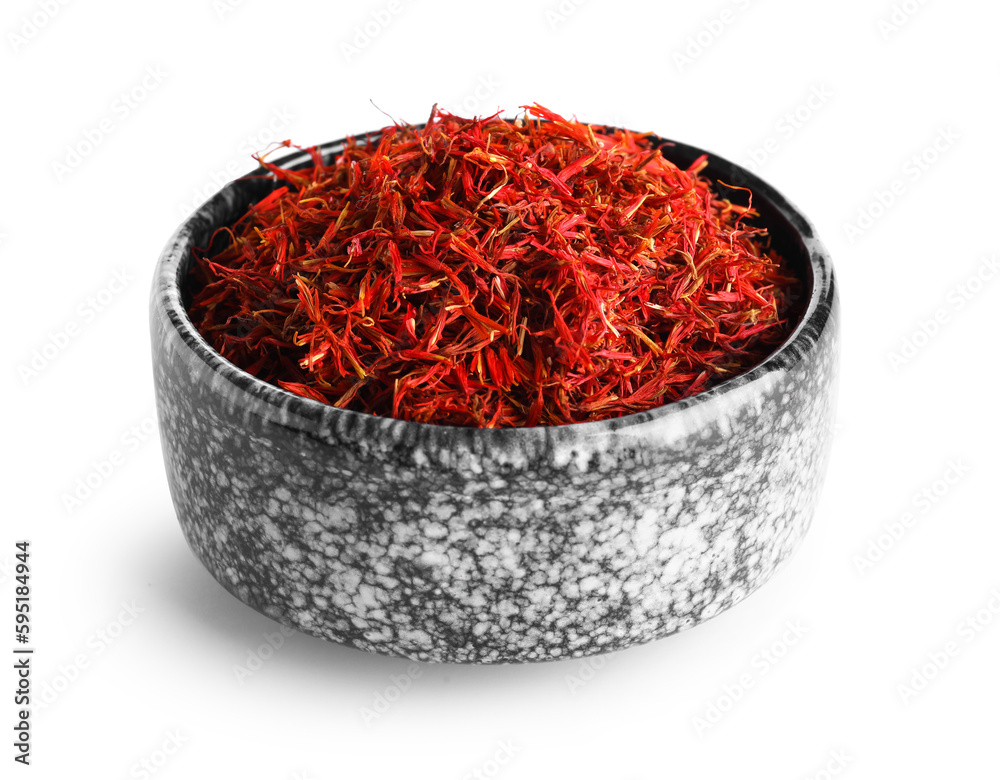 Fototapeta premium Bowl with Pile of saffron on white background